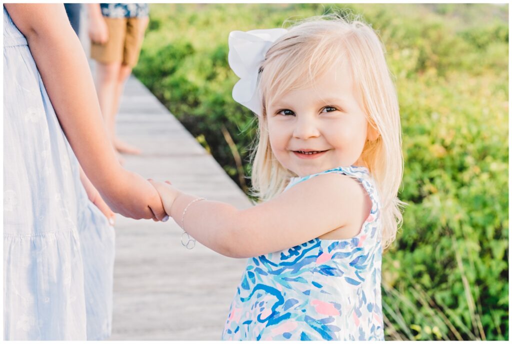 Charleston beach photographer capturing genuine moments between cousins